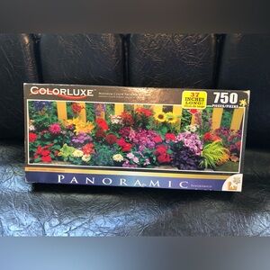 835 New Colorluxe Panoramic 750 Piece Jigsaw Puzzle entitled "Summer's Garden”
